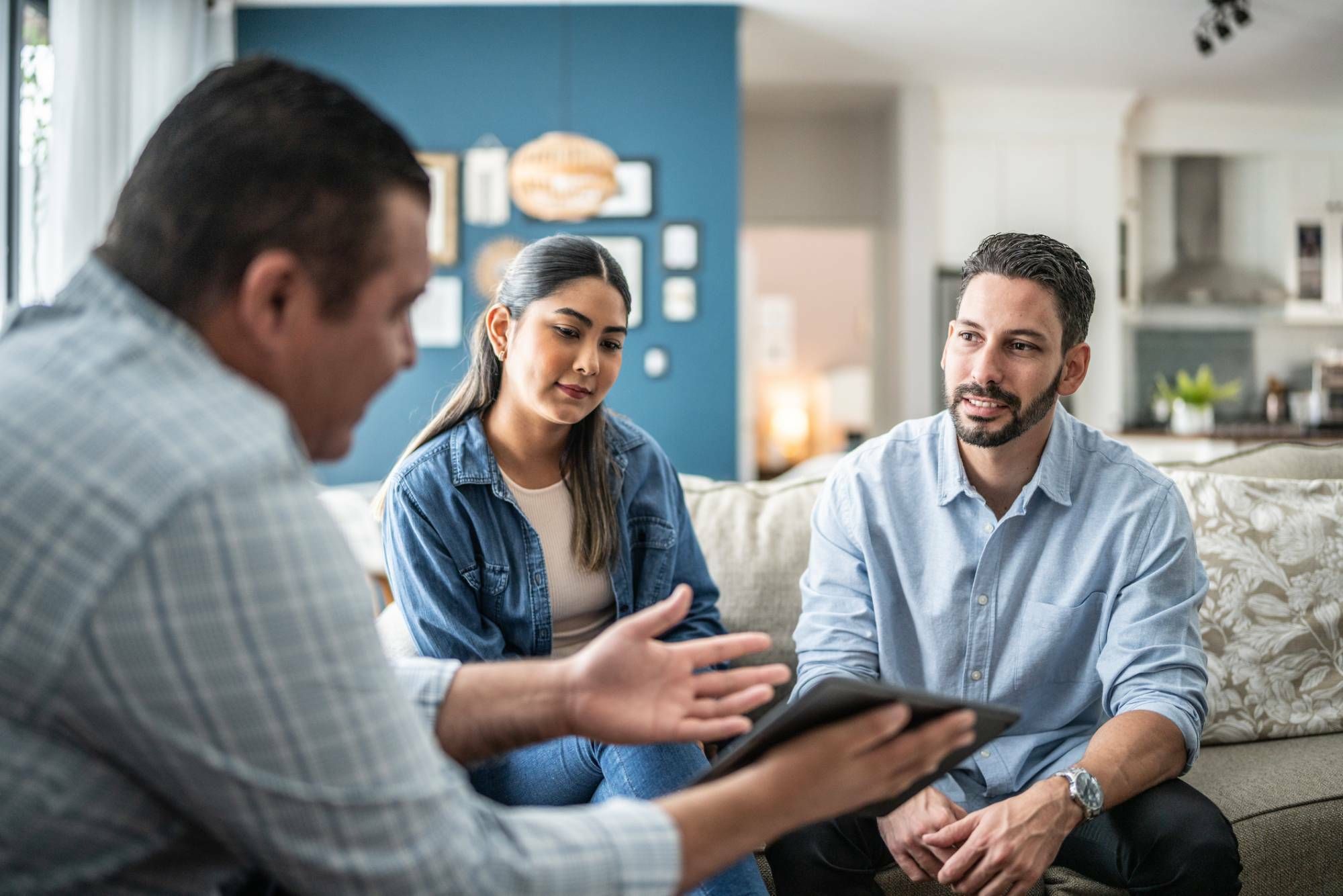 Couple learning about title insurance with real estate agent