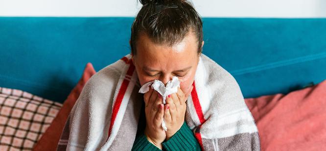 Woman with cold or flu symptoms