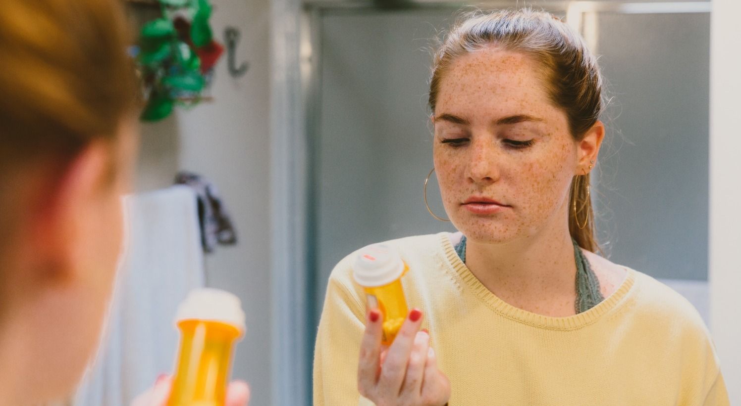 woman at home asking questions about prescription from primary care doctor