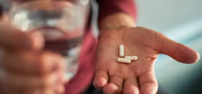 Man holding prescription medicine