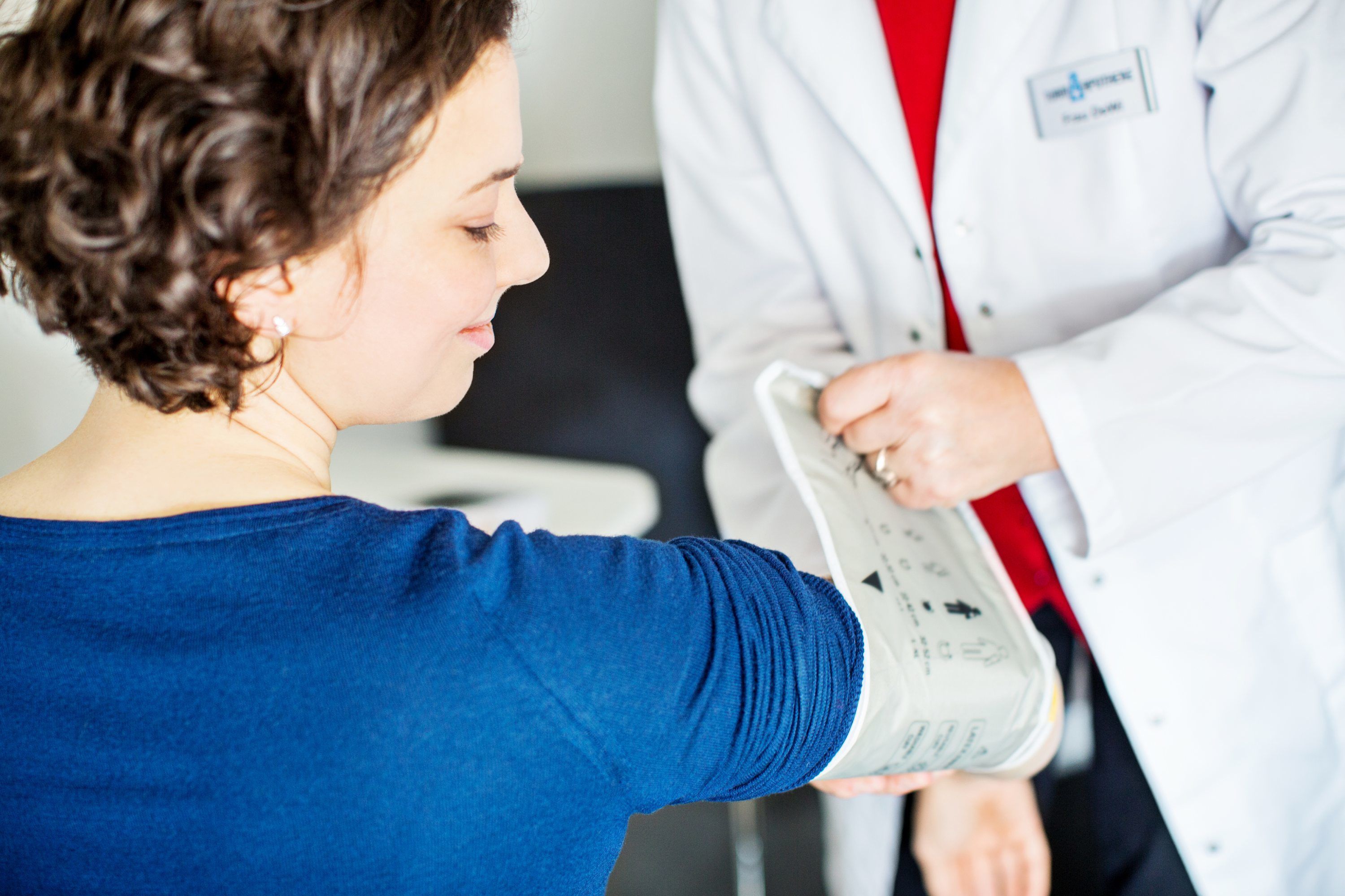 Woman getting blood pressure checked