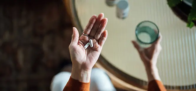 Woman taking antibiotics