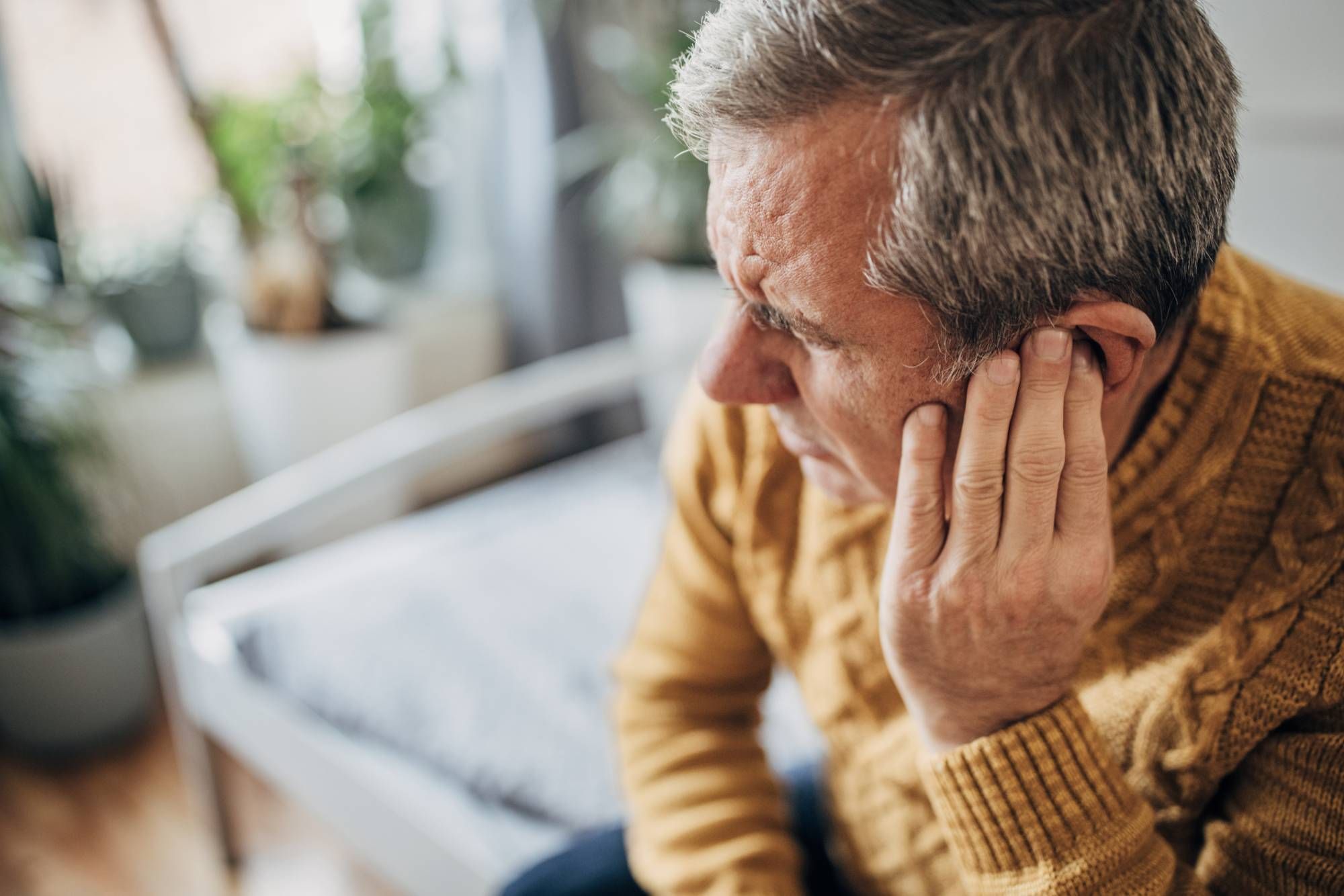 Adult man with an ear infection