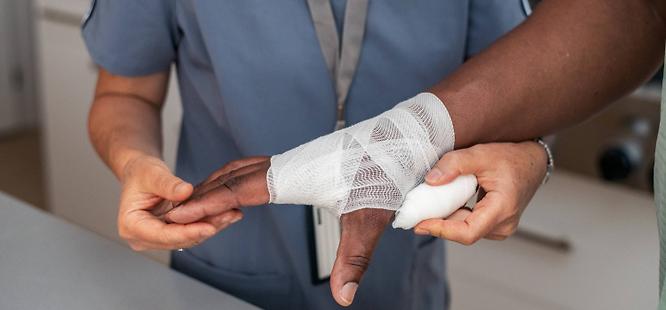 Man at urgent care for burn on hand