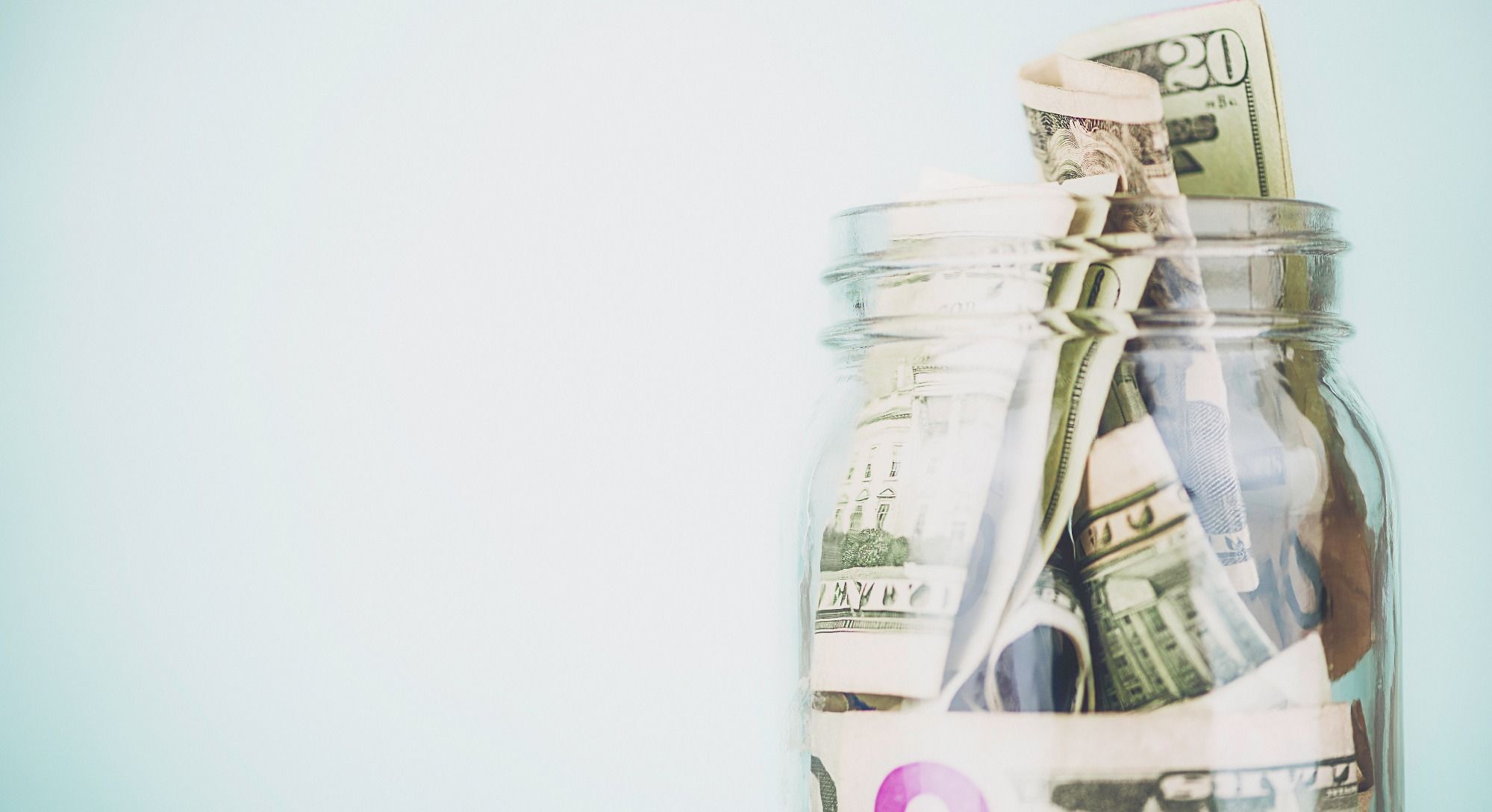 glass jar of cash saved going to urgent care instead of the er