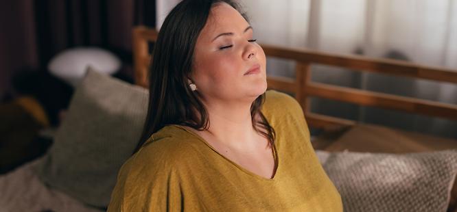 Woman before visit to urgent care for asthma