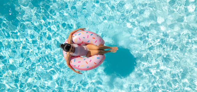 Woman floating in the pool in alabama