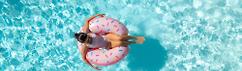 Woman floating in the pool in alabama