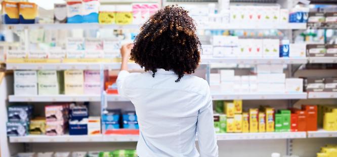 Woman looking at medicine and antibiotics