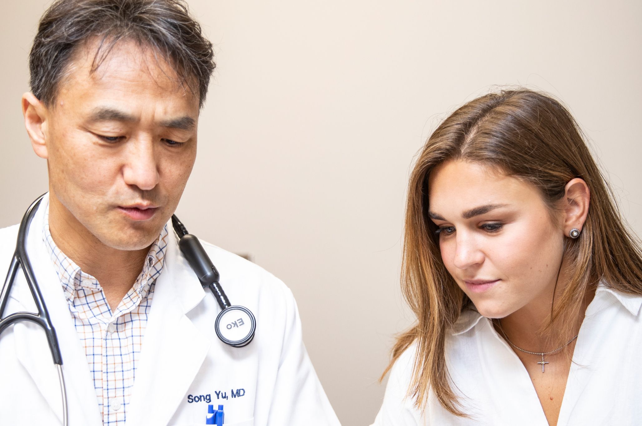 Dr Yu with female patient at MedHelp Urgent Care and Primary Care Clinic