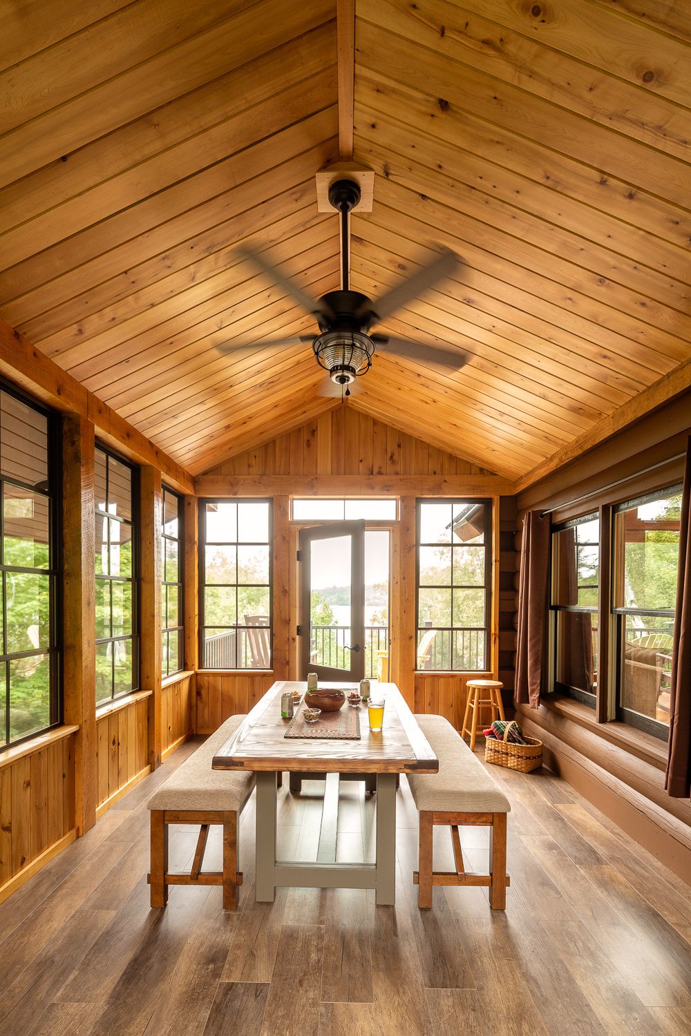 Three-season porch addition on an existing lake house
