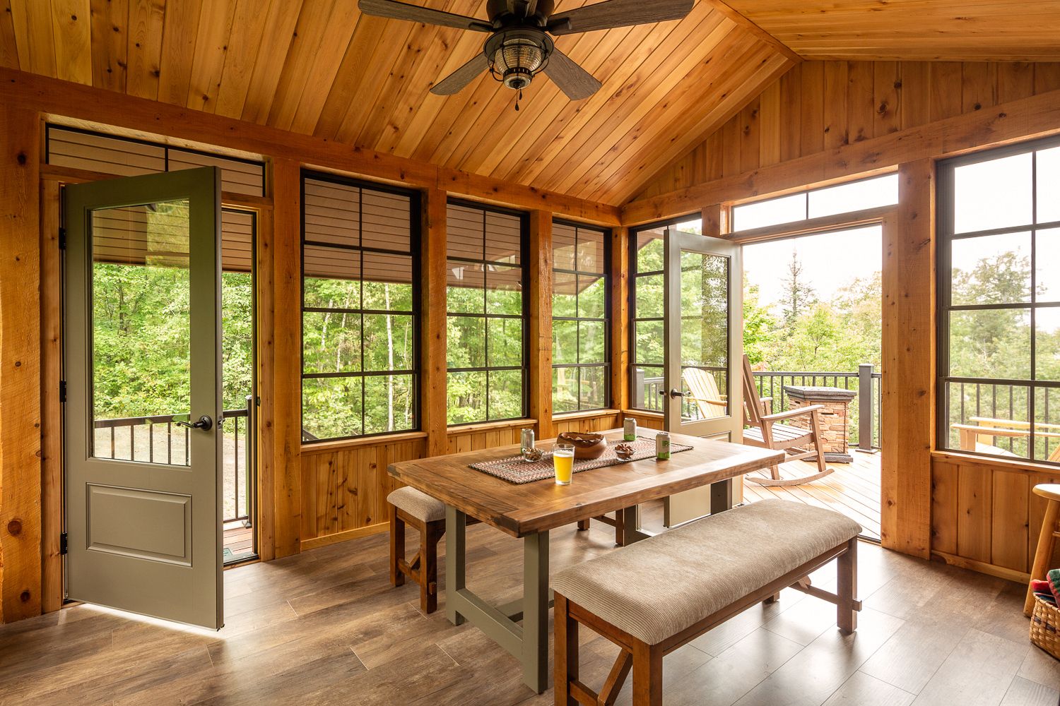 Three-season porch addition on an existing lake house