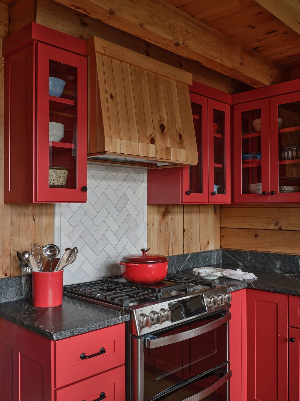 Custom range hood and herringbone backsplash at Sanctuary Camp