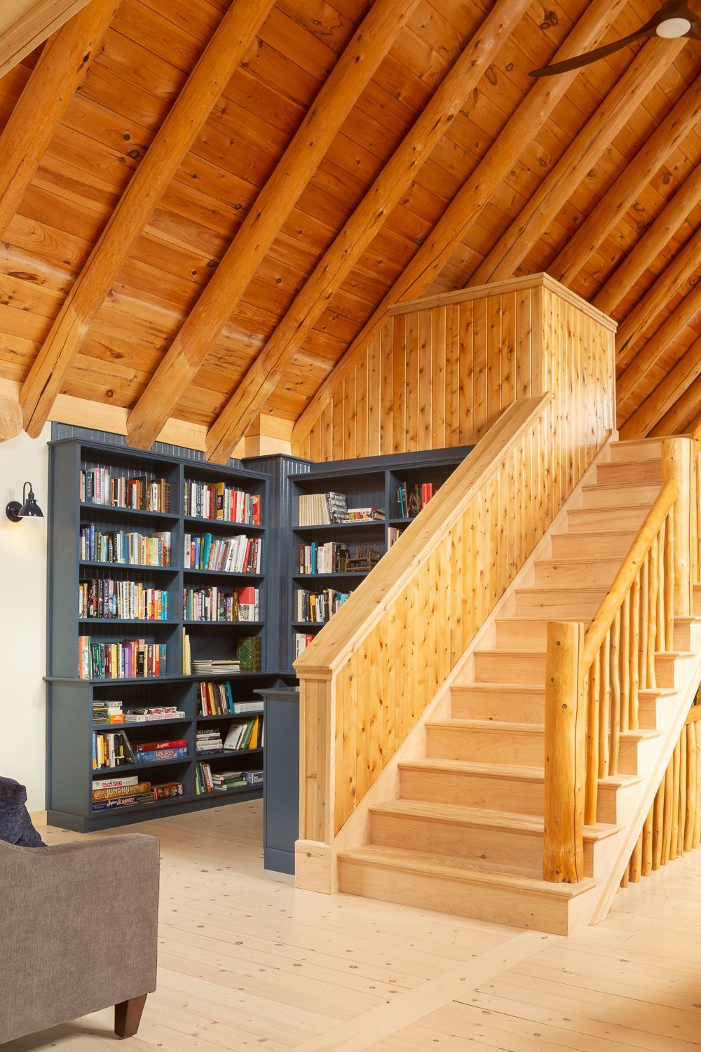 Built-in library in custom paint color with crown detail at Cedar Cottage