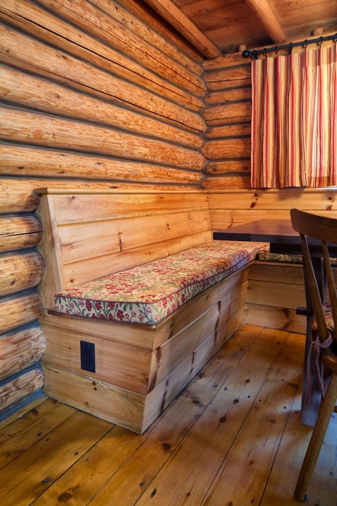 Built-in dining banquette in a log cabin