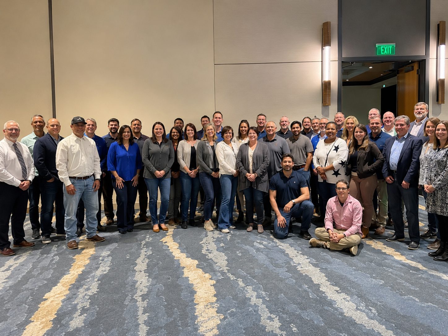 Field and operations team members standing in a service workspace.