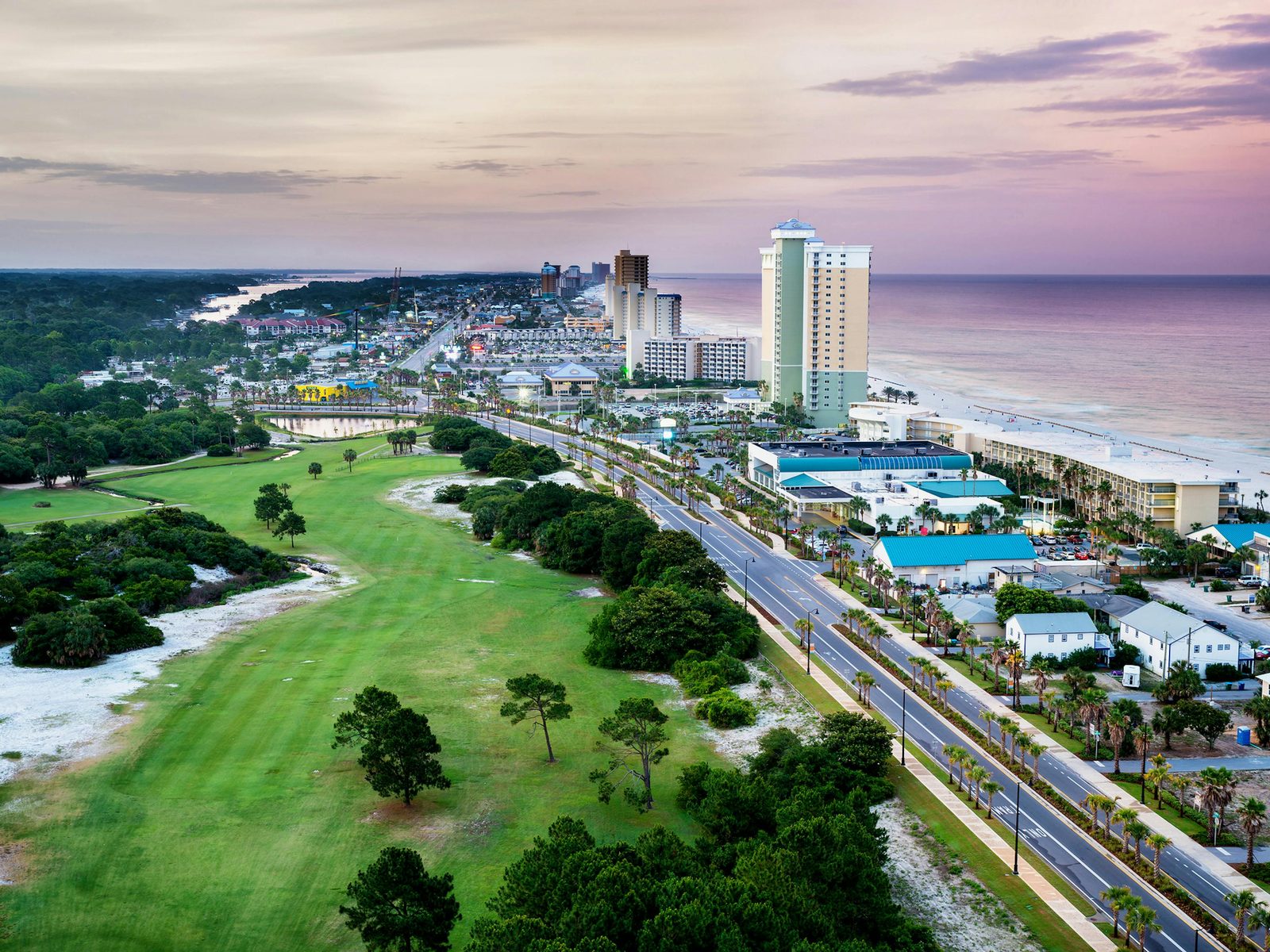 Panama City Beach coastline and Front Beach Road at sunrise.