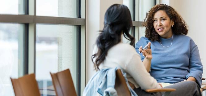 Realtor answering client questions about title ins and closing