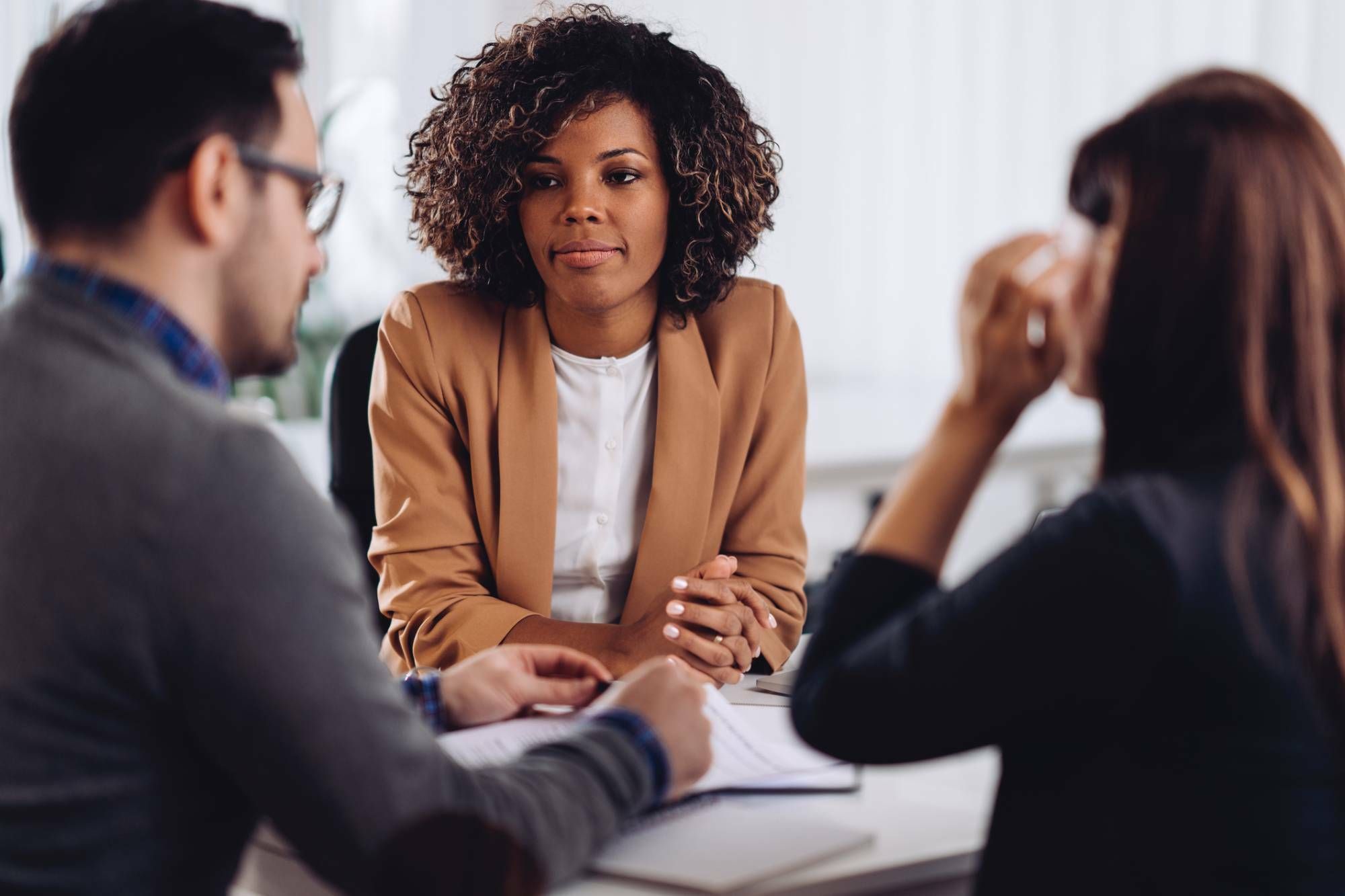 Realtor talking to clients after closing delay