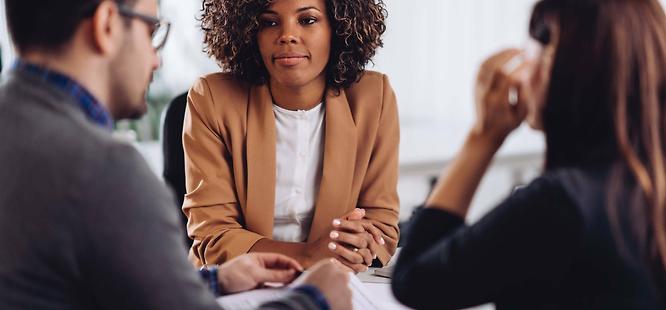 Realtor talking to clients after closing delay