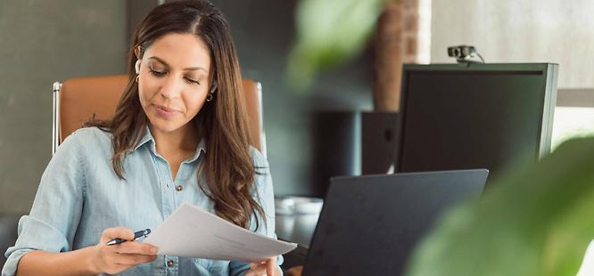 Title professional reviewing documents for closing