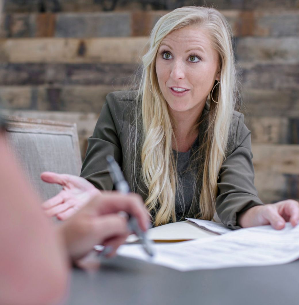 female closer and attorney helping a client close at south oak title and closing