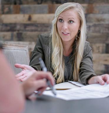 female closer and attorney helping a client close at south oak title and closing